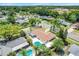 Overhead view of a residence with a pool, patio, and landscaping in a residential neighborhood at 1604 Nottingham Dr, Winter Park, FL 32792
