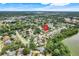 Aerial view of the property's location within a residential area near a lake and wooded areas at 1604 Nottingham Dr, Winter Park, FL 32792