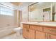 Bathroom featuring a shower, toilet, vanity, and a large mirror at 1604 Nottingham Dr, Winter Park, FL 32792