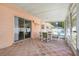 Outdoor covered patio with brick flooring, seating, and views of the backyard pool at 1604 Nottingham Dr, Winter Park, FL 32792