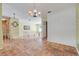 Open floorplan with tiled entry flowing seamlessly into the adjacent living spaces at 1604 Nottingham Dr, Winter Park, FL 32792