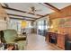 Cozy Gathering room with wood paneling, beamed ceiling, and easy access to the kitchen at 1604 Nottingham Dr, Winter Park, FL 32792