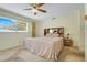 The main bedroom has a neutral color scheme, carpeted floors, and a large window at 1604 Nottingham Dr, Winter Park, FL 32792