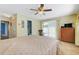Spacious main bedroom with a ceiling fan, closet, and sliding doors to the backyard at 1604 Nottingham Dr, Winter Park, FL 32792