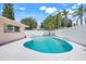 Backyard pool featuring a refreshing blue hue and a white concrete pool deck, perfect for relaxation at 1604 Nottingham Dr, Winter Park, FL 32792
