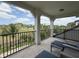 Relaxing balcony with golf course views and comfortable outdoor seating at 1056 Castle Pines Ct, Reunion, FL 34747