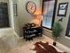 Charming entryway features a decorative rug, stylish shoe rack, and plantation shutters for a welcoming ambiance at 1056 Castle Pines Ct, Reunion, FL 34747