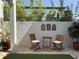 Cozy patio with seating area, planters and ambient decorations at 1056 Castle Pines Ct, Reunion, FL 34747