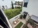 Private outdoor patio featuring brick flooring, seating, and lush landscaping at 1056 Castle Pines Ct, Reunion, FL 34747