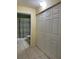 Bathroom with a toilet and white bi-fold doors at 313 Morning Creek Cir, Apopka, FL 32712