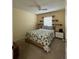 Cozy bedroom with neutral walls, a comfortable bed, and decorative shelves above the window at 313 Morning Creek Cir, Apopka, FL 32712