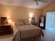Serene bedroom featuring large windows, tile floors and comfortable furnishings at 313 Morning Creek Cir, Apopka, FL 32712