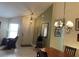 Dining area featuring neutral walls, a chandelier, and a wooden table at 313 Morning Creek Cir, Apopka, FL 32712