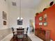 Dining area featuring neutral walls, a chandelier, and a wooden table with seating for four at 313 Morning Creek Cir, Apopka, FL 32712