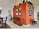 View of the dining room featuring a colorful accent wall and wood furniture at 313 Morning Creek Cir, Apopka, FL 32712