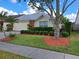 Charming home featuring well-manicured landscaping and a lush green lawn at 313 Morning Creek Cir, Apopka, FL 32712