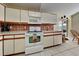 Kitchen featuring modern appliances, tile floors, and plenty of cabinet space at 313 Morning Creek Cir, Apopka, FL 32712