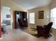 Bright office space features a wooden desk, tile flooring, and large windows at 313 Morning Creek Cir, Apopka, FL 32712