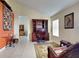 Inviting office space featuring a wooden desk, tile flooring, and large windows at 313 Morning Creek Cir, Apopka, FL 32712