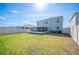 Spacious backyard with a well-maintained lawn, enclosed by a white privacy fence at 5616 Siltstone St, Lakeland, FL 33811