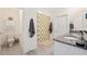 Bright bathroom with a shower, tile flooring and a double sink granite vanity at 5616 Siltstone St, Lakeland, FL 33811