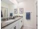 Stylish bathroom with granite countertop vanity, dual sinks, and tasteful decor at 5616 Siltstone St, Lakeland, FL 33811