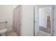 Conveniently located bathroom with a toilet and shower, situated near an open doorway for easy access at 5616 Siltstone St, Lakeland, FL 33811
