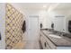 Bright bathroom with a shower, tile flooring and a double sink granite vanity at 5616 Siltstone St, Lakeland, FL 33811