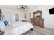Beautiful bedroom with modern ceiling fan, wood-look floors, and ample natural light at 5616 Siltstone St, Lakeland, FL 33811