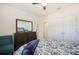 Comfortable bedroom with a plush bed, mirror, and double door closet at 5616 Siltstone St, Lakeland, FL 33811
