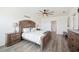 Spacious bedroom with a ceiling fan, wooden furniture, and attractive flooring at 5616 Siltstone St, Lakeland, FL 33811