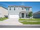 Charming two-story home featuring a well-maintained lawn and a classic architectural design at 5616 Siltstone St, Lakeland, FL 33811
