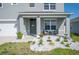Charming front porch with decorative landscaping, seating, and welcoming decor on a sunny day at 5616 Siltstone St, Lakeland, FL 33811