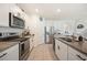 Well-appointed kitchen with stainless steel appliances, granite countertops, and ample cabinet space at 5616 Siltstone St, Lakeland, FL 33811