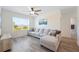 Spacious living room with a large sectional couch and a view from the window, ideal for relaxation at 5616 Siltstone St, Lakeland, FL 33811