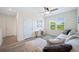 Comfortable living room featuring a large sectional, a window with a view, and ample natural light at 5616 Siltstone St, Lakeland, FL 33811