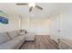 Cozy living room with a sectional couch, view from window and ample natural light, perfect for relaxation at 5616 Siltstone St, Lakeland, FL 33811