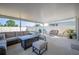 Relaxing screened patio with a cozy seating area, perfect for enjoying the outdoors at 5616 Siltstone St, Lakeland, FL 33811