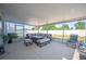 Relax on the spacious screened patio with outdoor seating and views of the lush backyard at 5616 Siltstone St, Lakeland, FL 33811