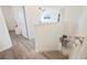 Upper level staircase featuring modern railings, leading down to the kitchen at 5616 Siltstone St, Lakeland, FL 33811