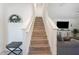 Beautiful staircase with wood treads and white risers, leading to the upper level of the home at 5616 Siltstone St, Lakeland, FL 33811