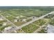 An aerial view displaying the property's location within the community at 2021 Valencia Dr, Indian Lake Estates, FL 33855