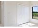 Well-lit bedroom featuring a closet and a window bringing in lots of natural light at 2021 Valencia Dr, Indian Lake Estates, FL 33855