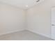Clean, well-lit room with neutral walls and flooring, creating a versatile space at 2021 Valencia Dr, Indian Lake Estates, FL 33855