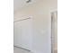 Bright and airy bedroom closet featuring a sliding white door at 2021 Valencia Dr, Indian Lake Estates, FL 33855