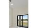Bright, spacious bedroom with a sliding glass door and outdoor views at 2021 Valencia Dr, Indian Lake Estates, FL 33855