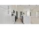 Bright kitchen with white cabinets, stainless steel appliances, and a large center island at 2021 Valencia Dr, Indian Lake Estates, FL 33855
