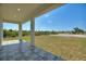 Covered patio featuring tile flooring and ample space for outdoor enjoyment at 2021 Valencia Dr, Indian Lake Estates, FL 33855
