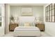 Serene bedroom featuring a neutral color palette, coordinated decor, and large windows at 2442 Mckinley Dr, Lake Wales, FL 33859