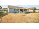 Backyard showcasing a screened patio and the home's exterior at 3055 Steeplechase Dr, Lakeland, FL 33811